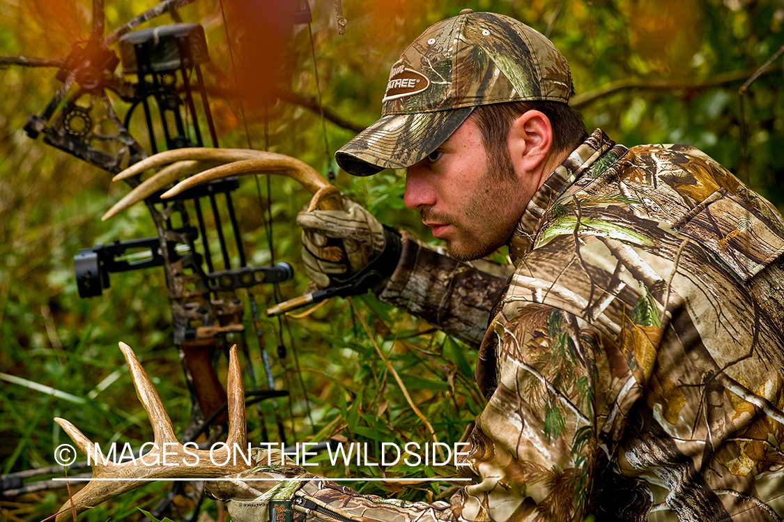 Bowhunter in field.