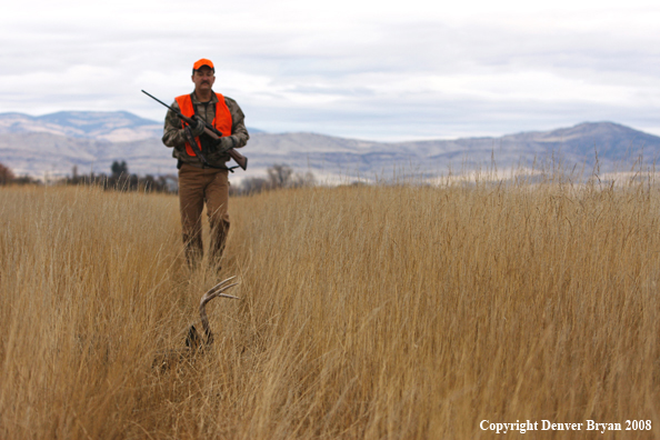 Hunter with Whitetail Deer