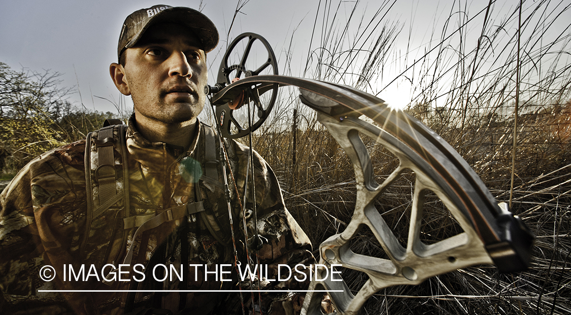 Bowhunter in field.
