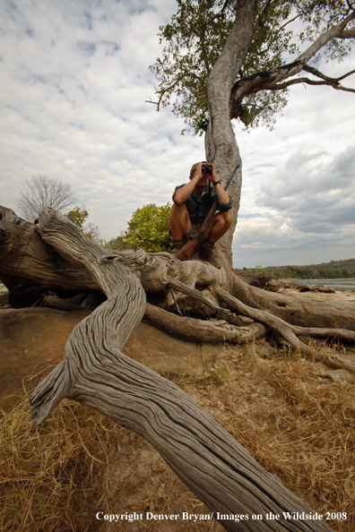 Hunter Scouting Area For Crocodiles