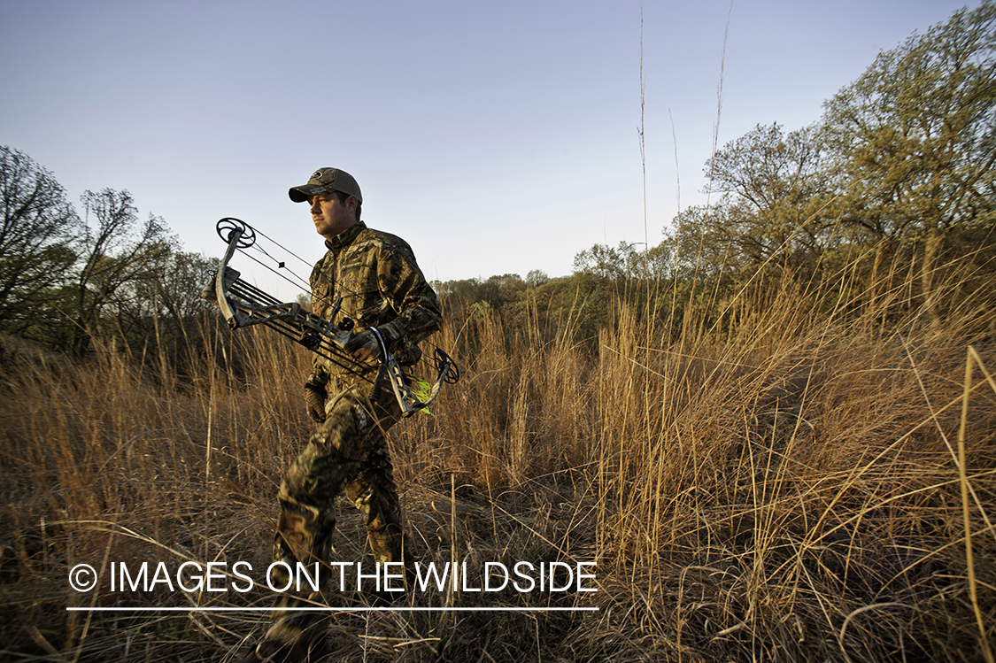 Bowhunter in field.