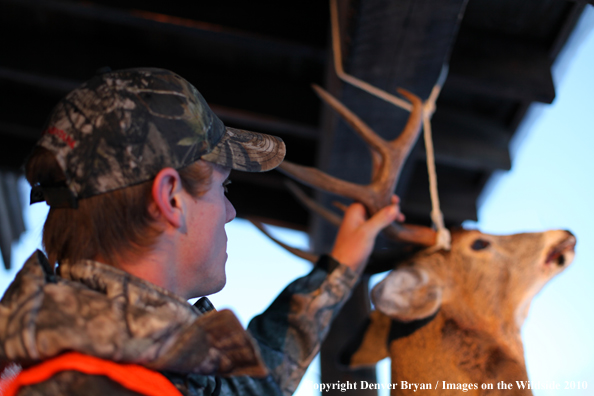 Hunter with bagged buck. 