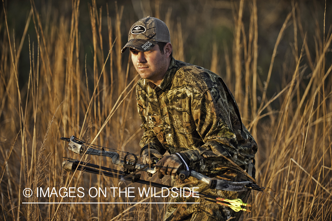 Bowhunter in field.