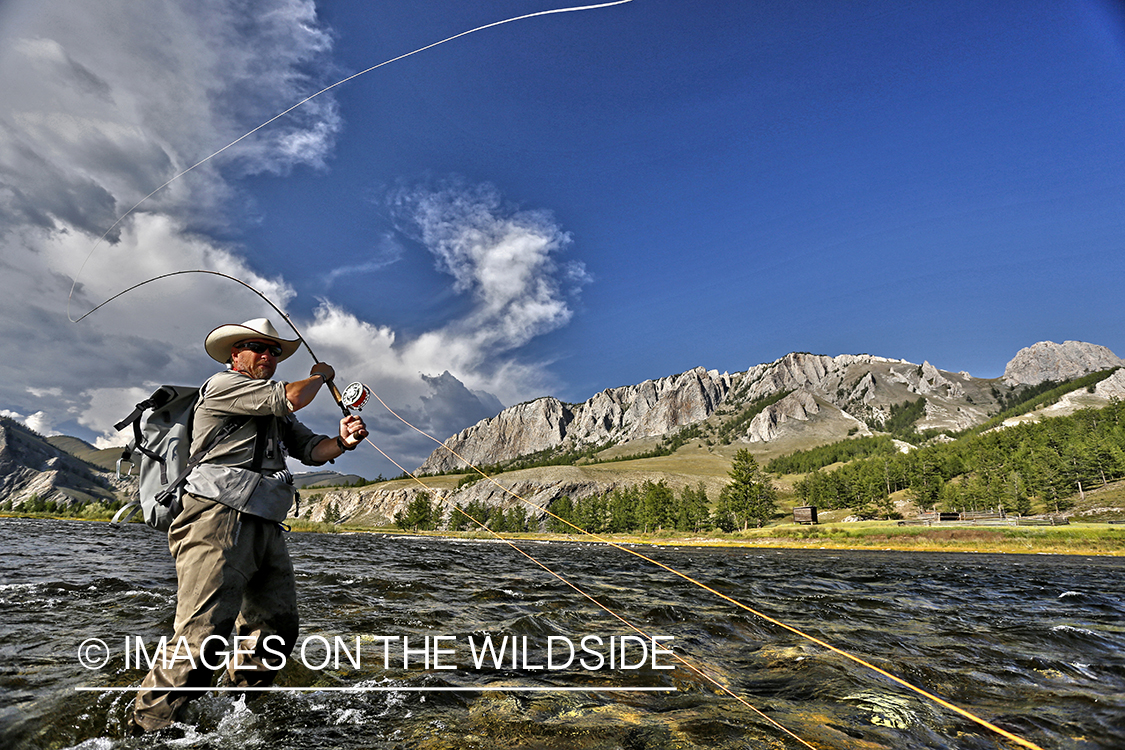 Flyfisherman casting spey/switch with Taimen fly.