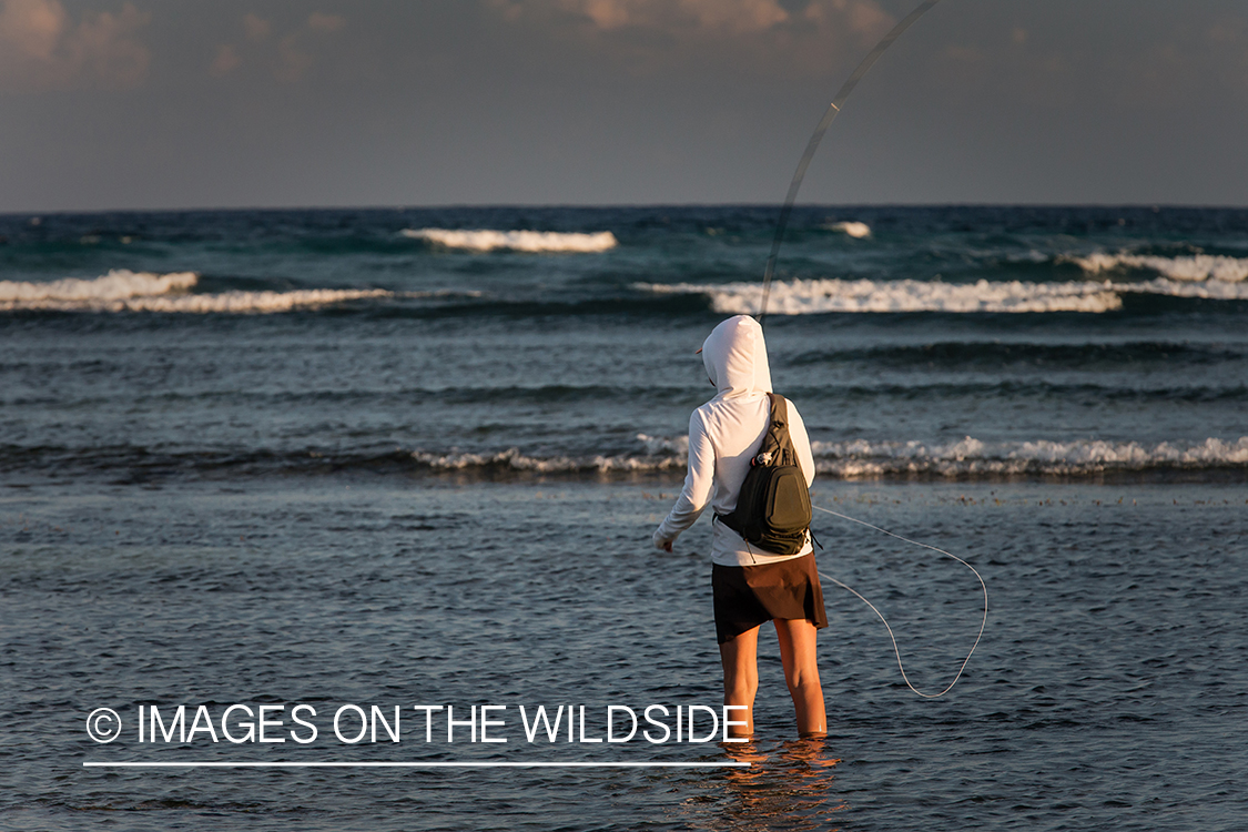 Flyfishing woman in flats.