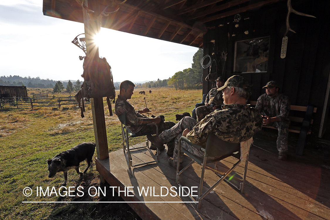 Bowhunters relaxing at elk hunting campsite.