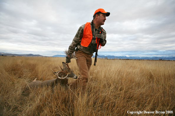 Hunter with Whitetail Deer