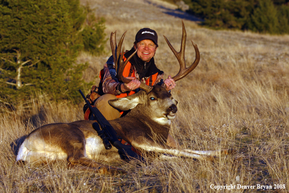 Hunter with Mule Deer