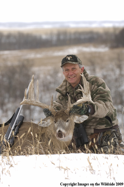 Hunter with Whitetail Deer