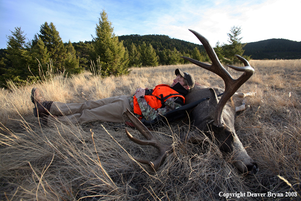 Hunter with Mule Deer