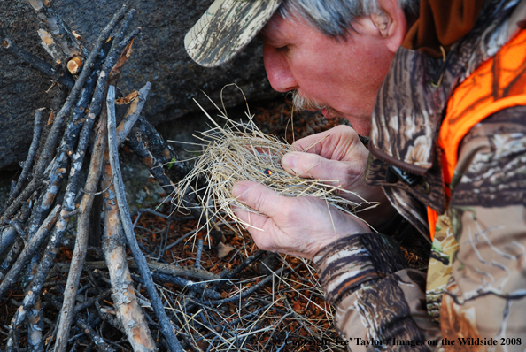 Big Game hunter starting fire