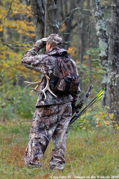 Bowhunter scouting for Big Game. 