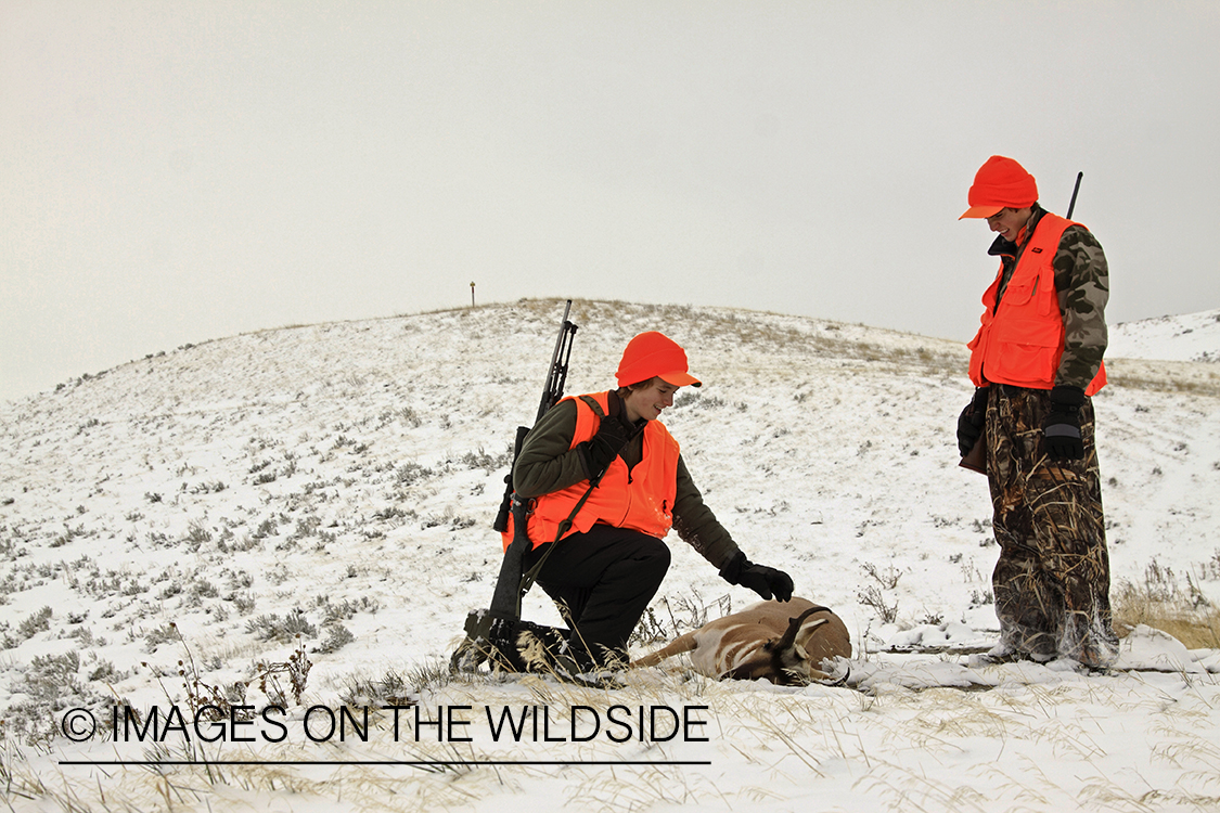 Young hunters with bagged pronghorn antelope. 
