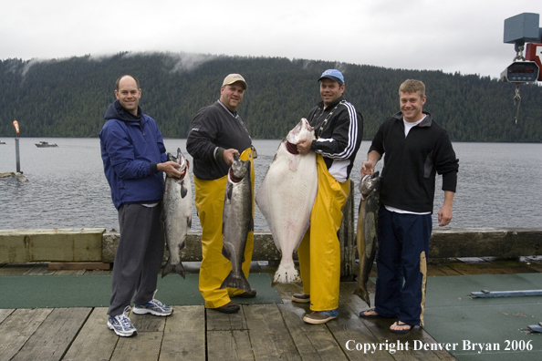 Fishermen with halibut and salmon catch.  (Alaska/Canada)