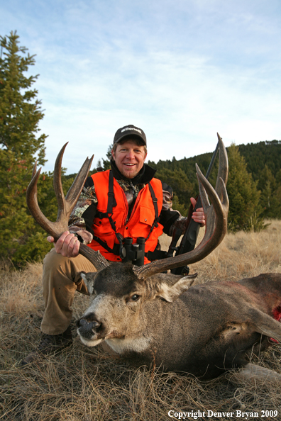 Hunter with Mule Buck