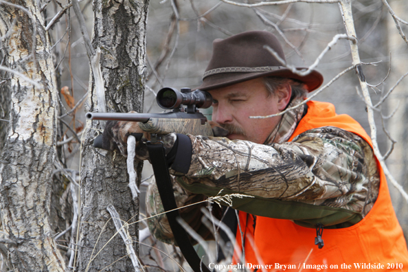 Hunter scouting for white-tailed deer. 