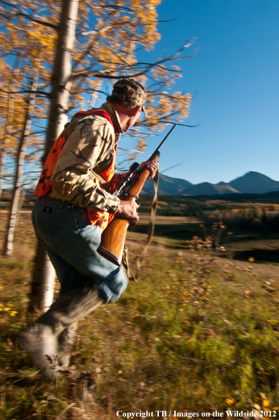 Big game hunter running. 