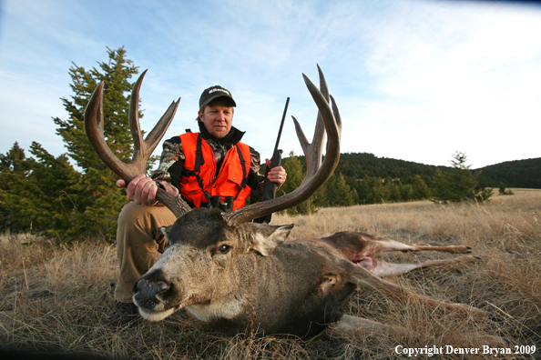 Hunter with Mule Buck