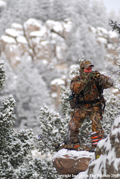 Bowhunter Glassing in Field