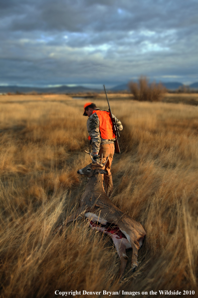 Hunter with Whitetail Deer (Original image # 11024-050.40D)