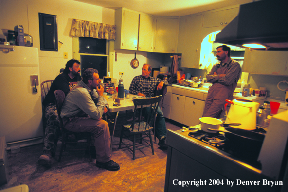 Big game hunters in cabin.