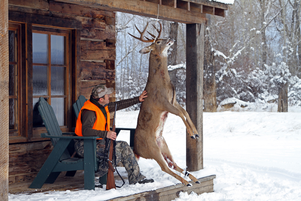 Hunter with bagged buck. 