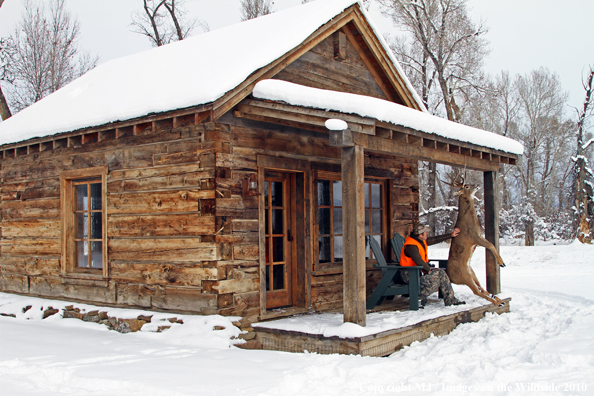 Hunter with bagged buck. 