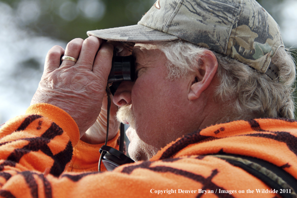 Big game hunter glassing for elk.